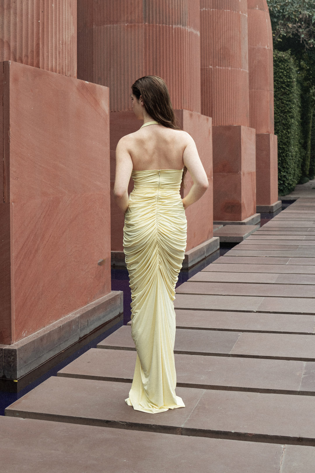 BUTTER YELLOW GATHERED HALTER GOWN WITH ROSE EMBELLISHMENTS