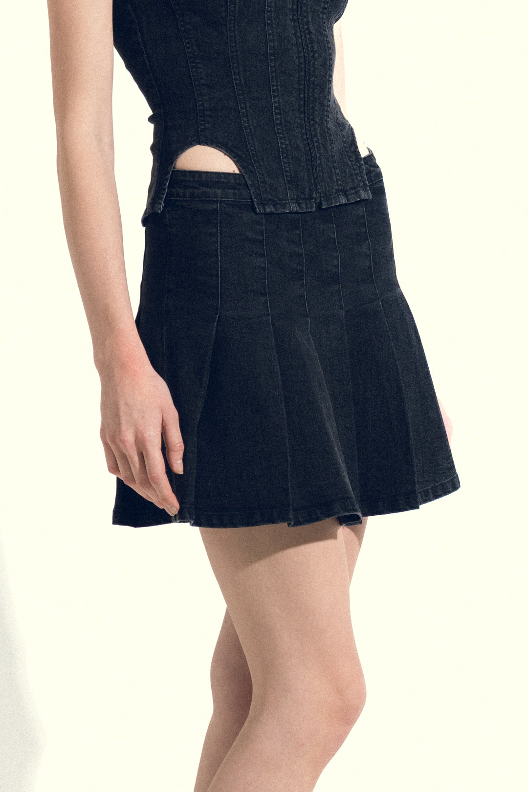 PLEATED BLACK DENIM MINI SKIRT