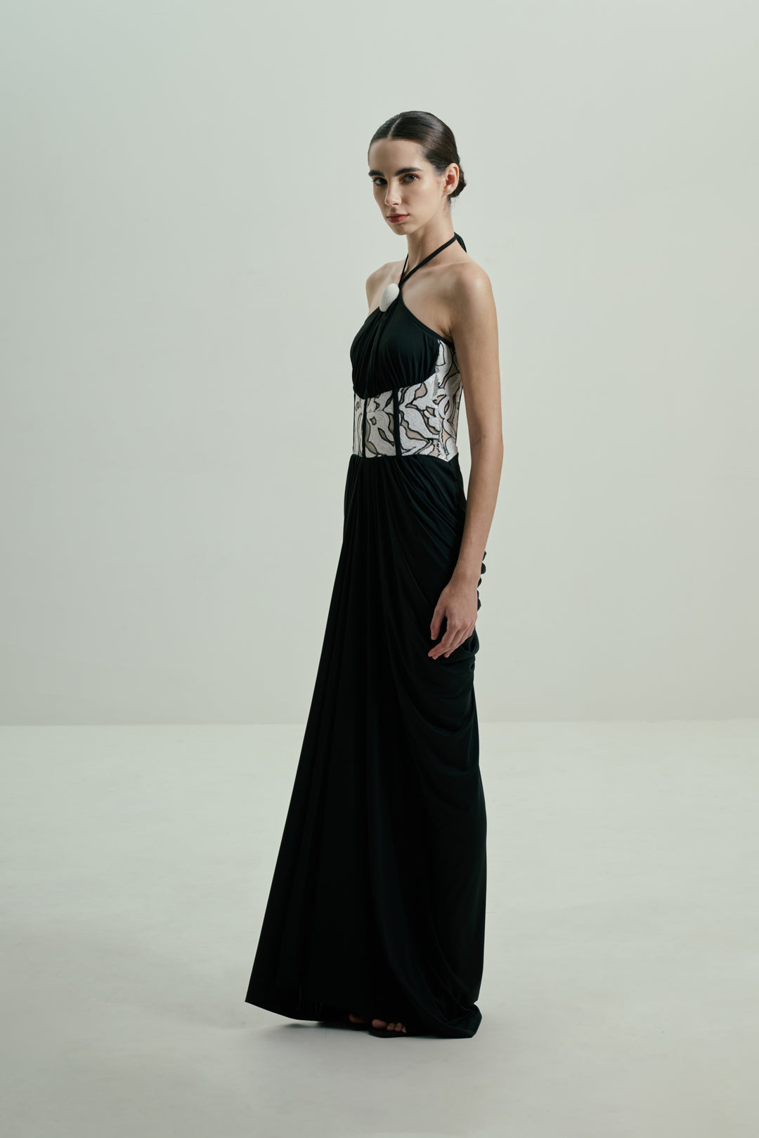 BLACK DRAPED GOWN WITH MONOCHROME SEQUIN CORSET