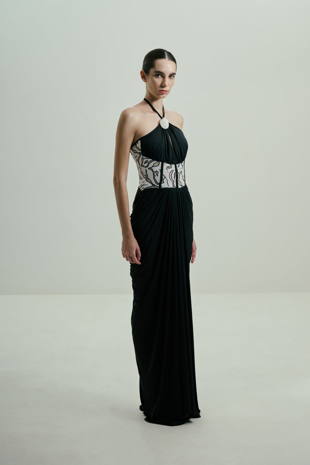 BLACK DRAPED GOWN WITH MONOCHROME SEQUIN CORSET