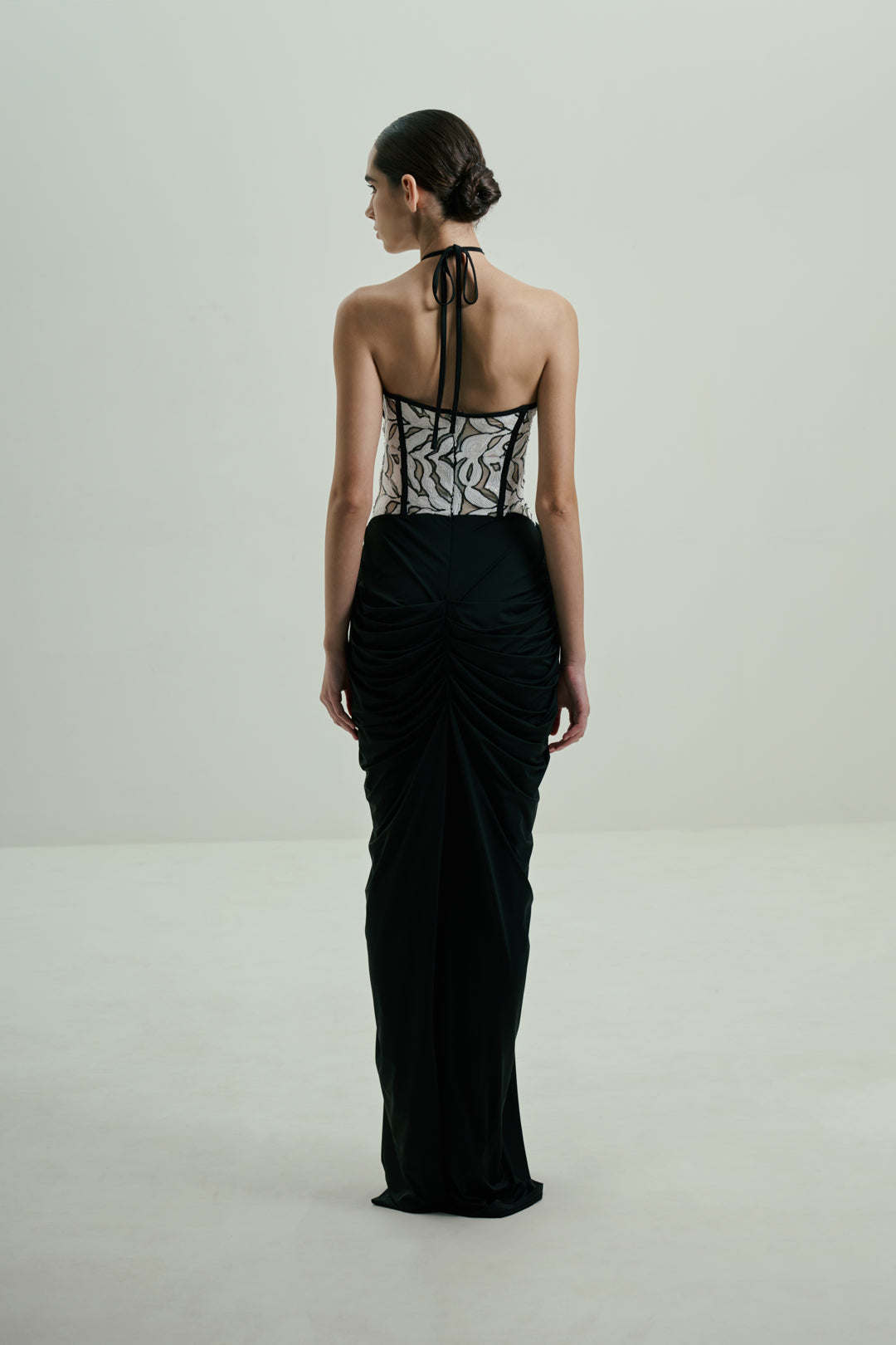 BLACK DRAPED GOWN WITH MONOCHROME SEQUIN CORSET