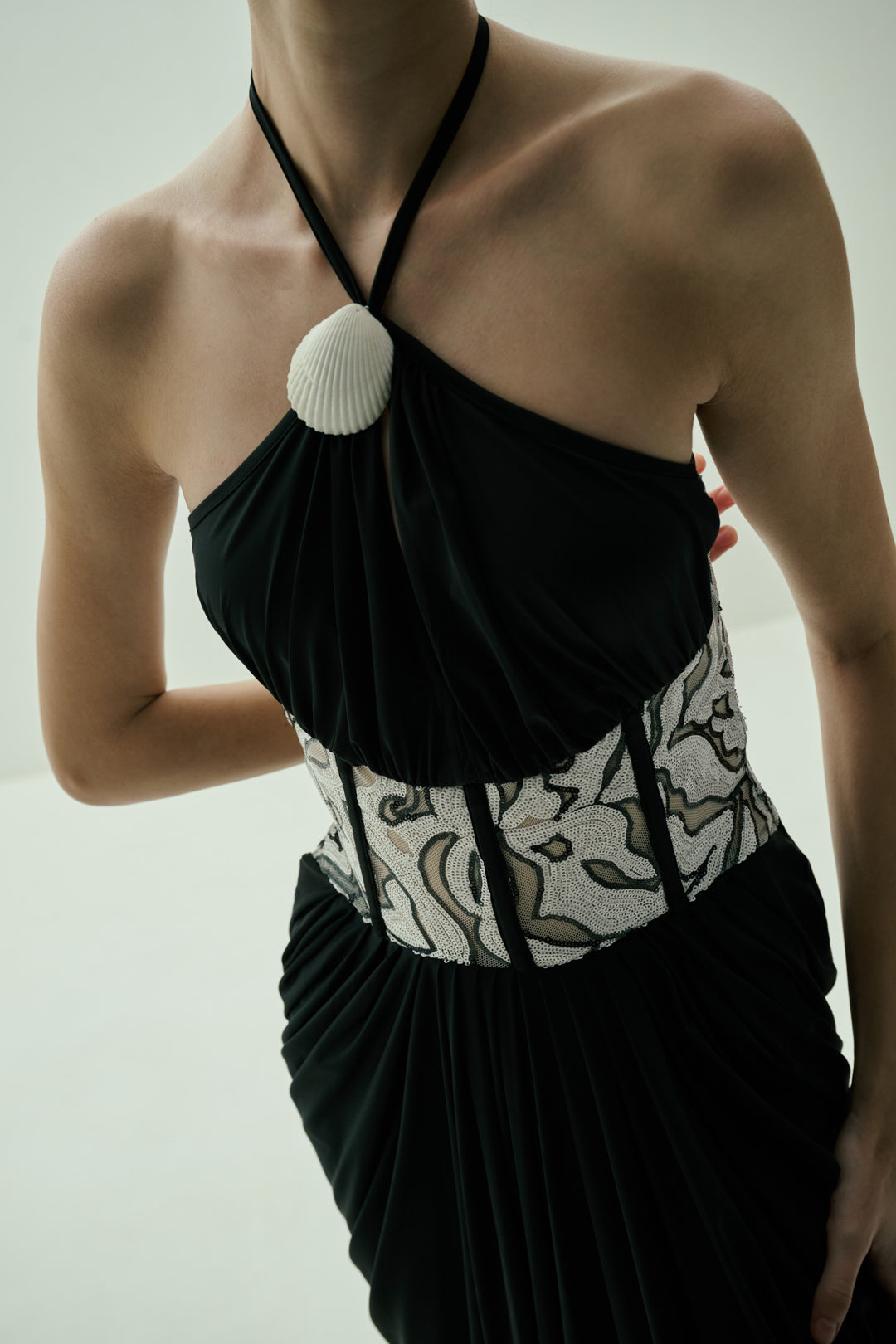BLACK DRAPED GOWN WITH MONOCHROME SEQUIN CORSET