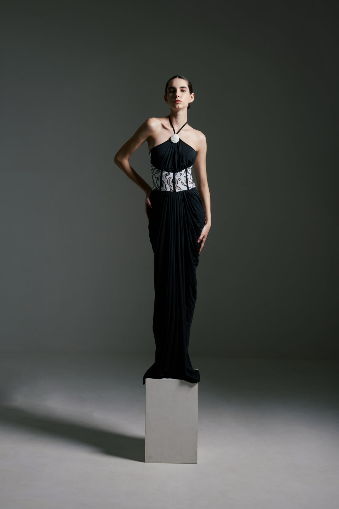 BLACK DRAPED GOWN WITH MONOCHROME SEQUIN CORSET