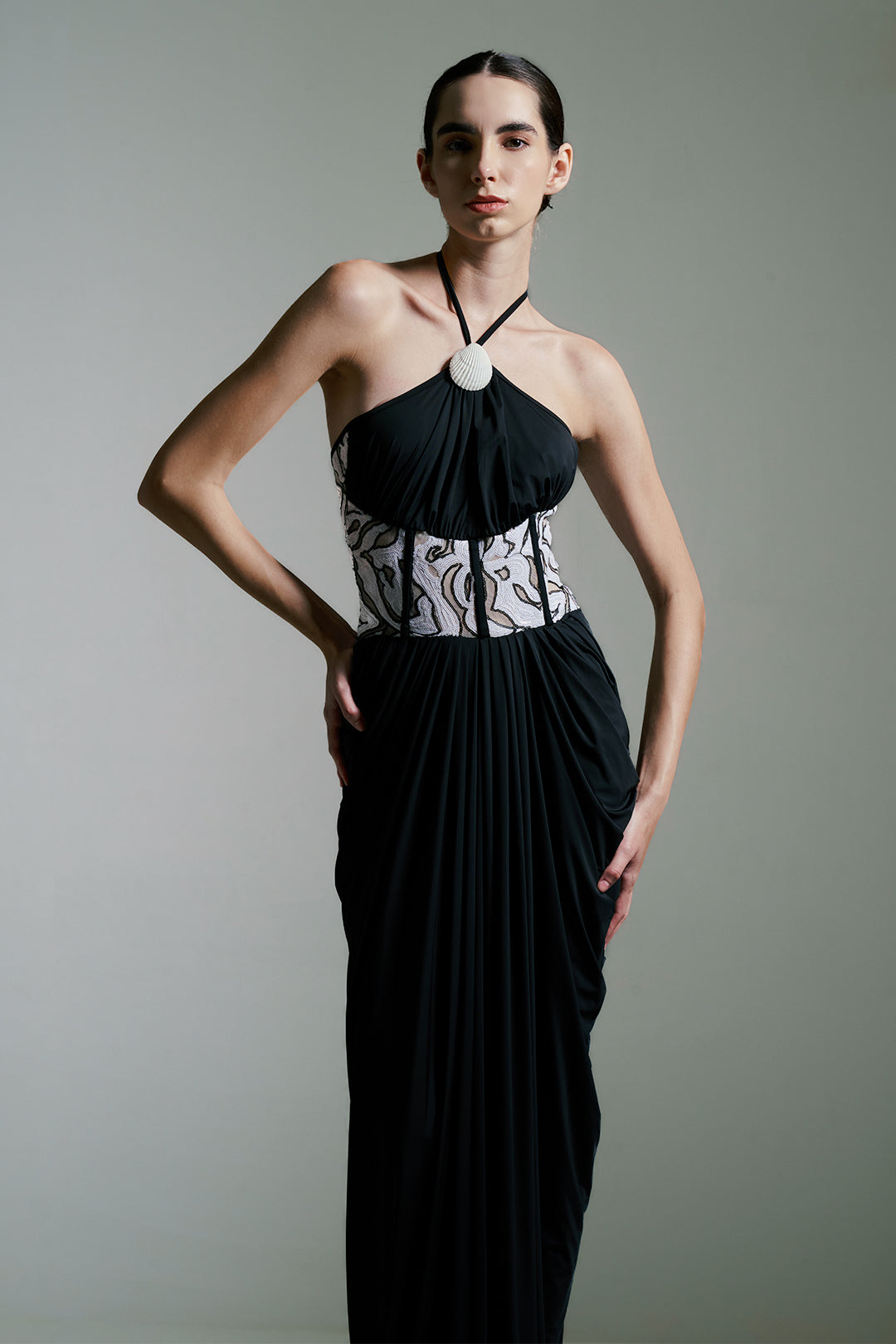 BLACK DRAPED GOWN WITH MONOCHROME SEQUIN CORSET