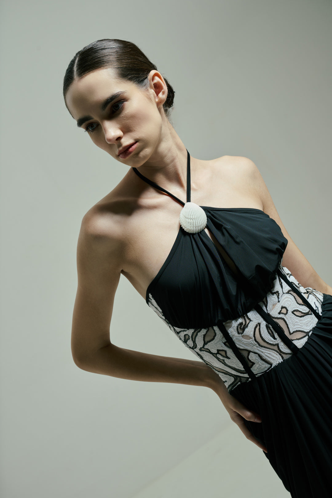 BLACK DRAPED GOWN WITH MONOCHROME SEQUIN CORSET