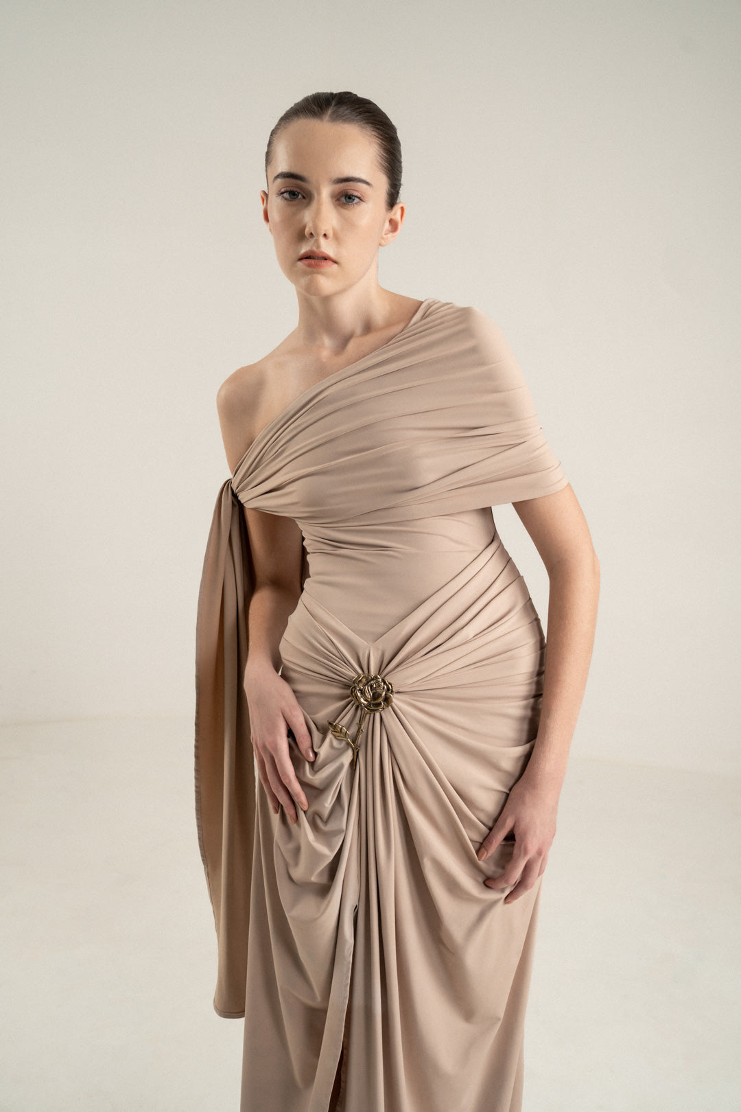 ONE-SHOULDER DRAPED DRESS WITH GOLD FLOWER DETAIL