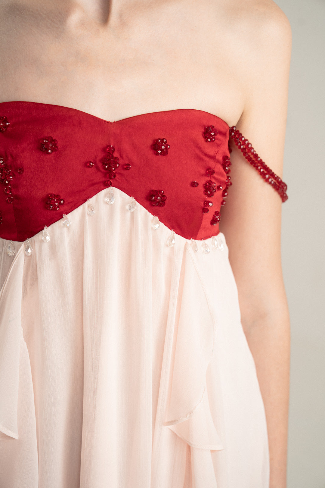 PINK FLOWING MIDI DRESS WITH RED EMBELLISHED BUSTIER