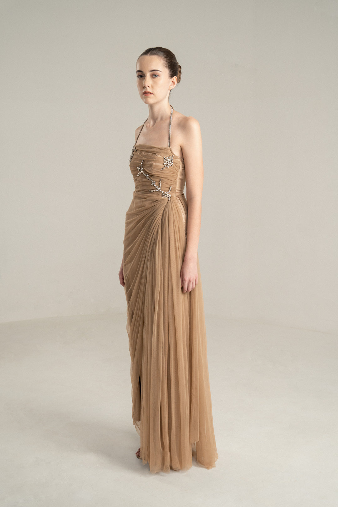 BEIGE DRAPED GOWN WITH RHINESTONE EMBELLISHMENTS