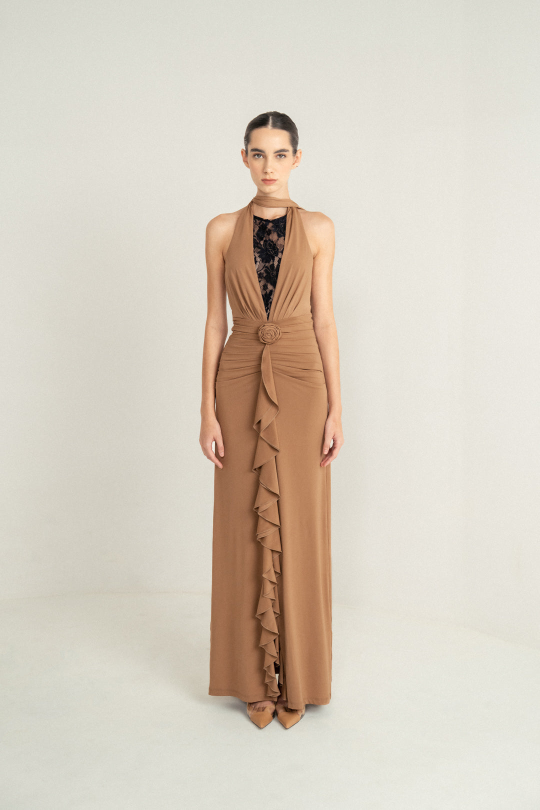 CAMEL DRAPE HALTER GOWN WITH ROSETTE DETAIL AND LACE INSERT