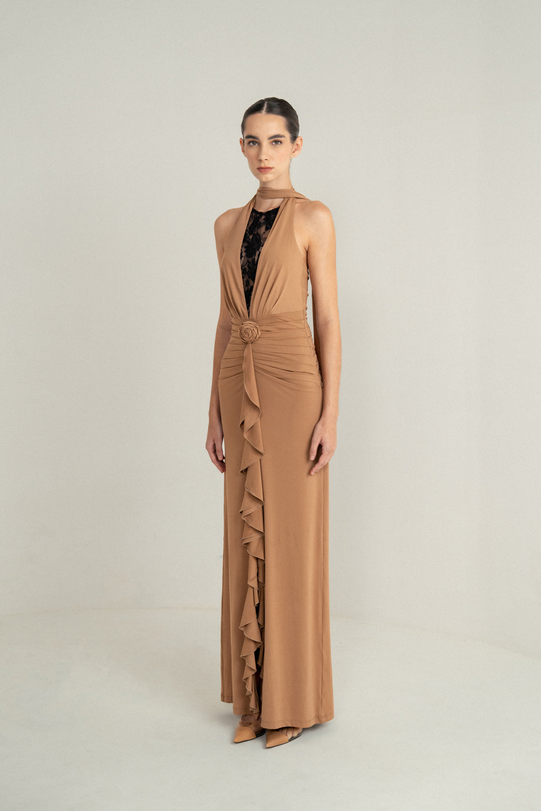 CAMEL DRAPE HALTER GOWN WITH ROSETTE DETAIL AND LACE INSERT