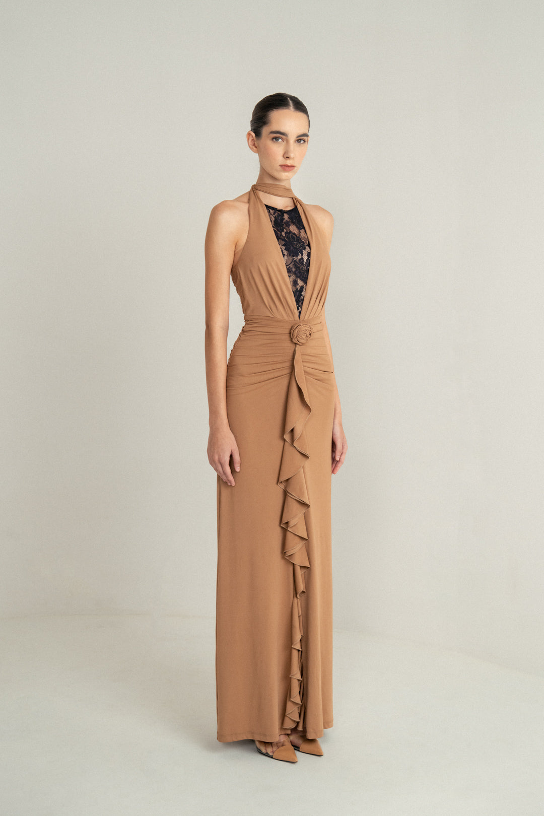 CAMEL DRAPE HALTER GOWN WITH ROSETTE DETAIL AND LACE INSERT