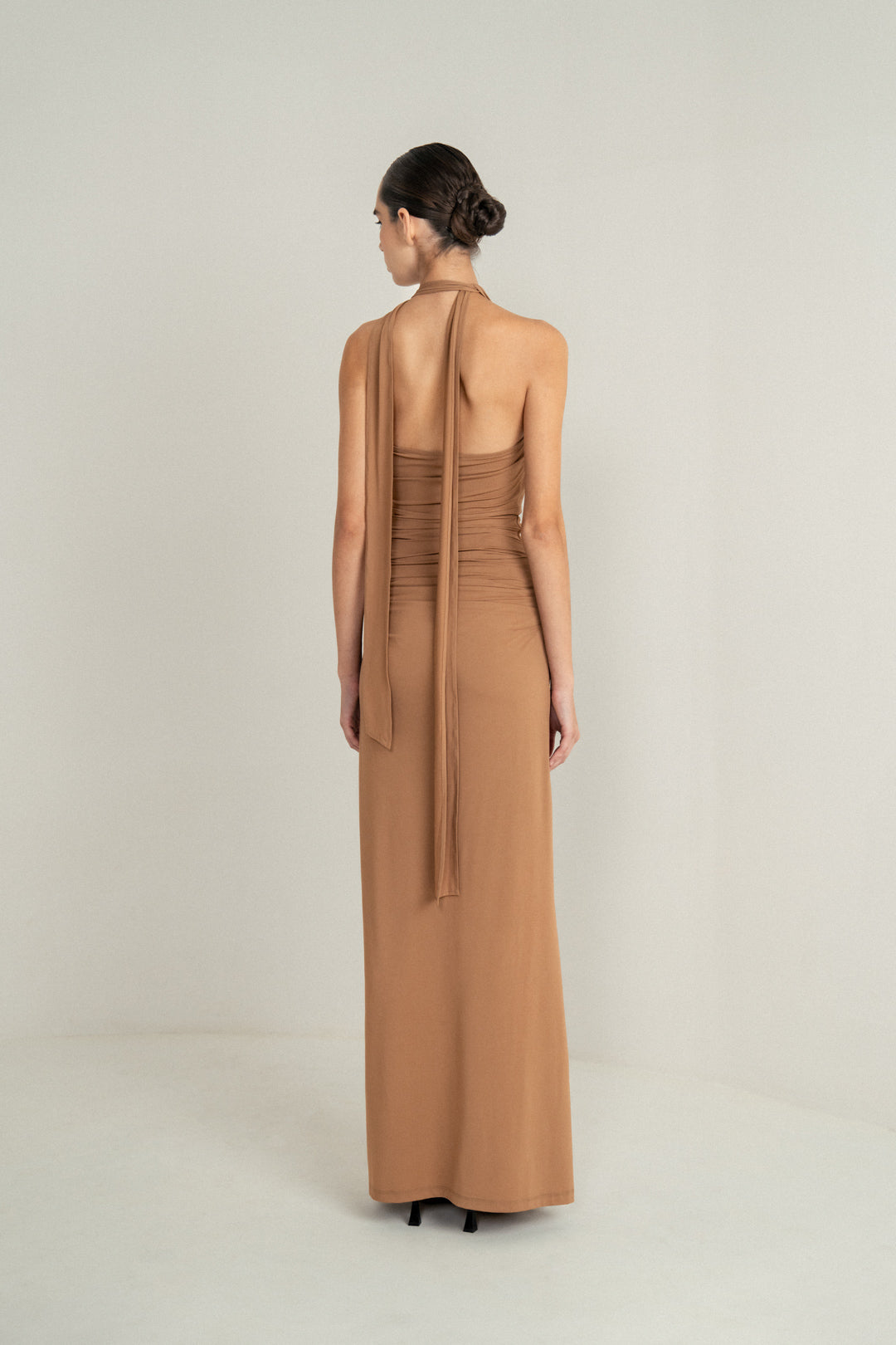CAMEL DRAPE HALTER GOWN WITH ROSETTE DETAIL AND LACE INSERT
