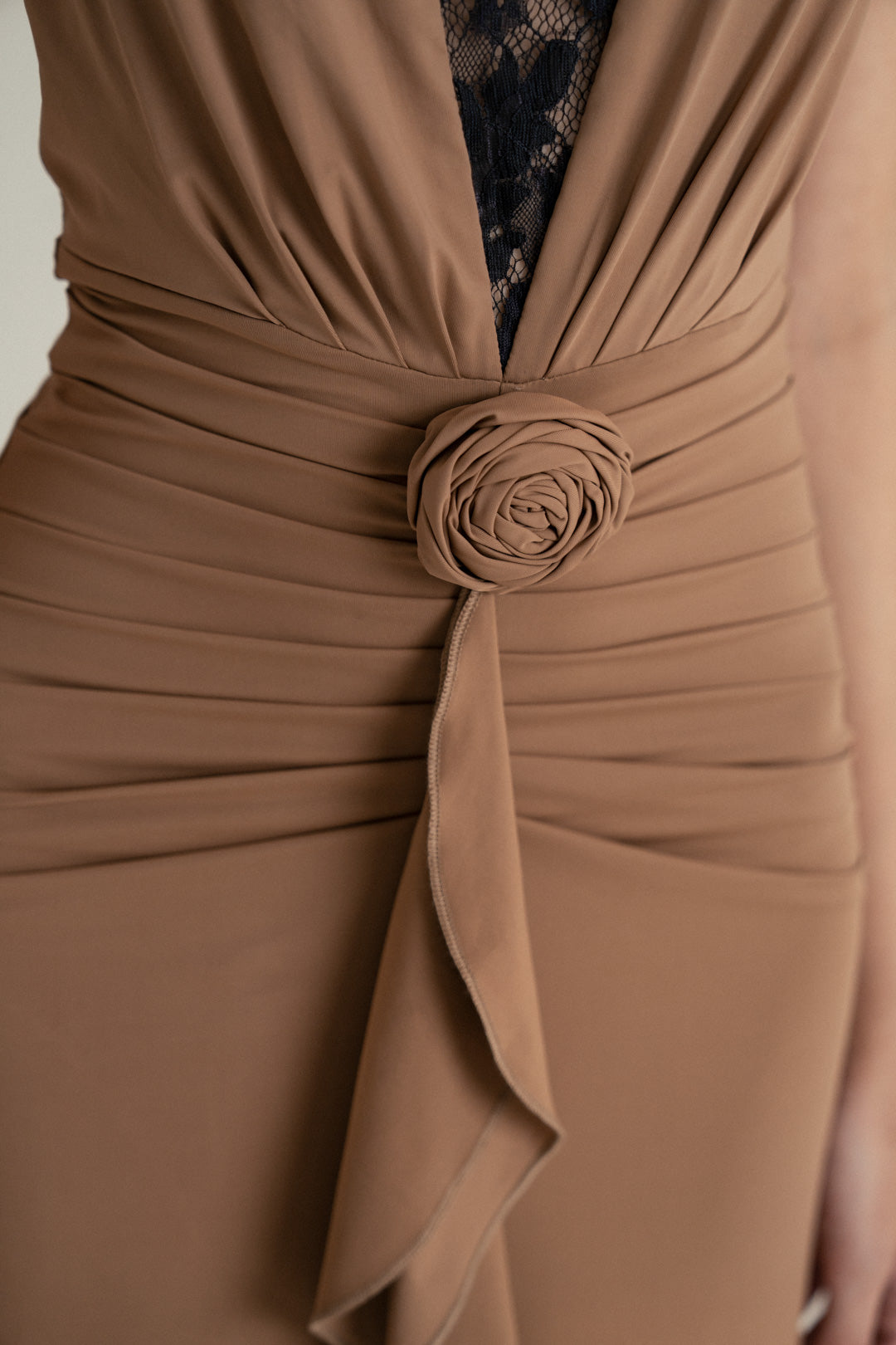 CAMEL DRAPE HALTER GOWN WITH ROSETTE DETAIL AND LACE INSERT