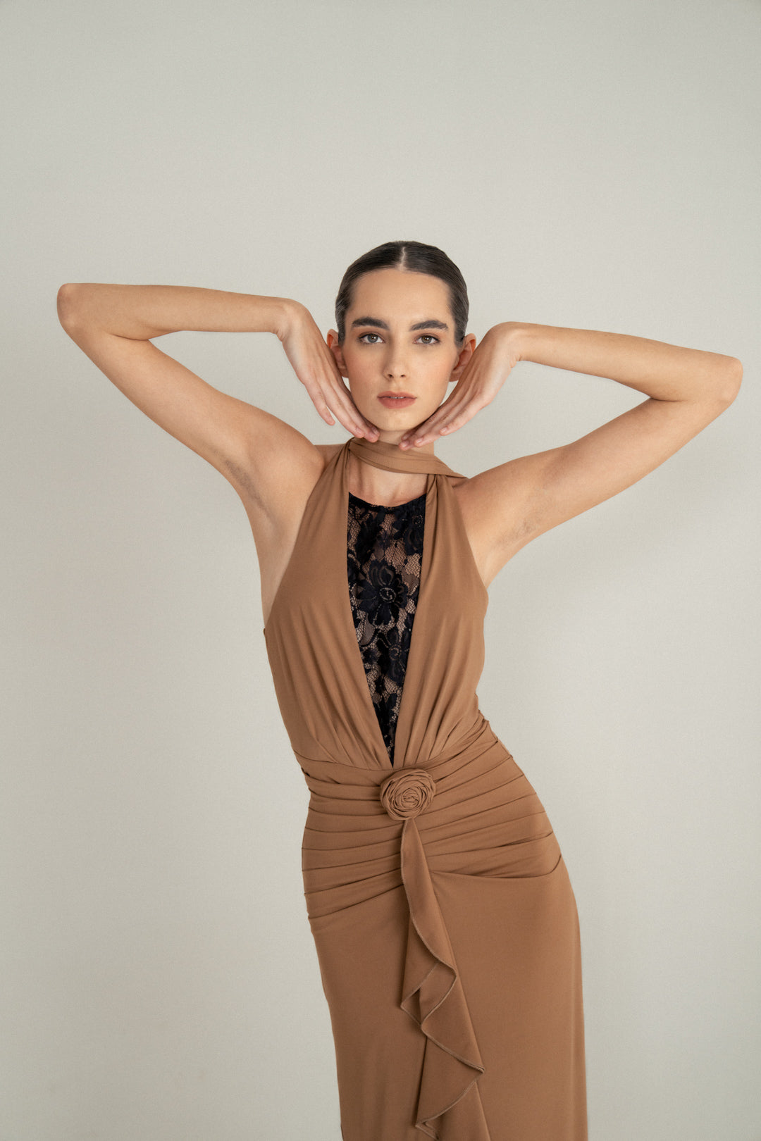 CAMEL DRAPE HALTER GOWN WITH ROSETTE DETAIL AND LACE INSERT