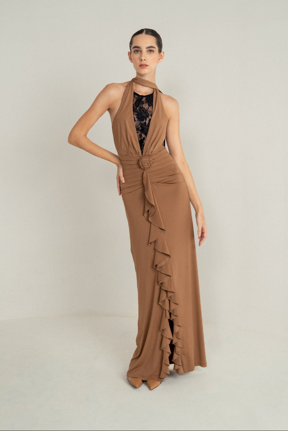 CAMEL DRAPE HALTER GOWN WITH ROSETTE DETAIL AND LACE INSERT