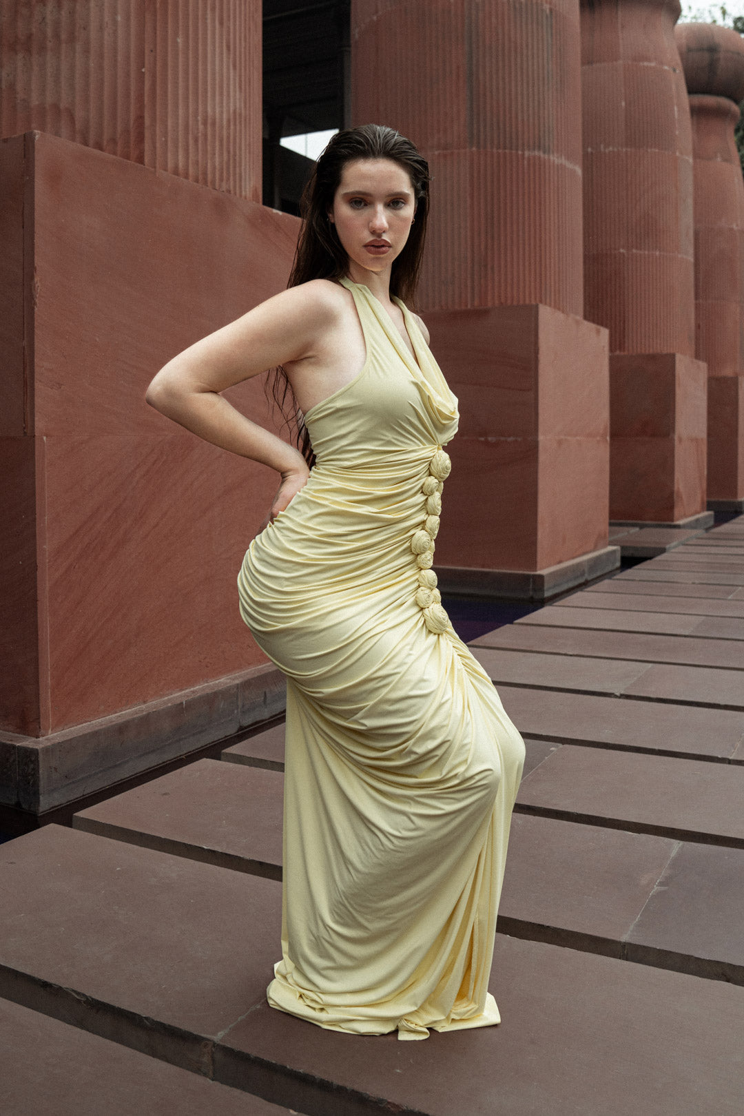 BUTTER YELLOW GATHERED HALTER GOWN WITH ROSE EMBELLISHMENTS