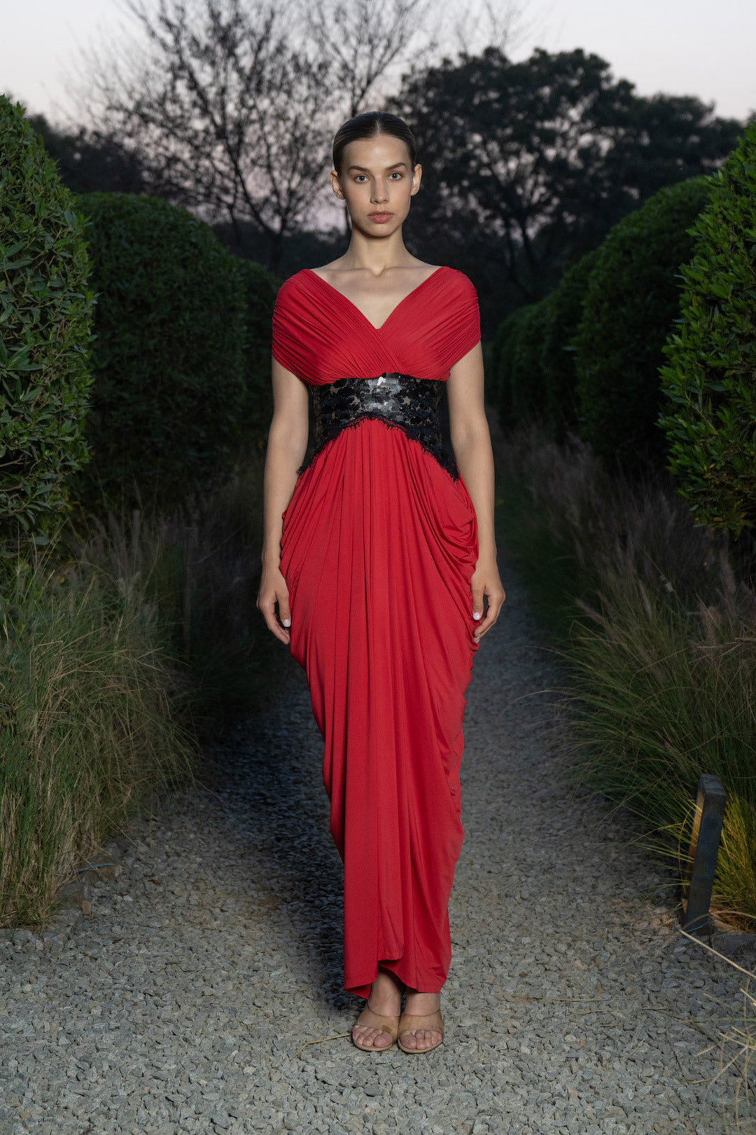 RED DRAPED EVENING GOWN WITH EMBELLISHED WAIST DETAIL