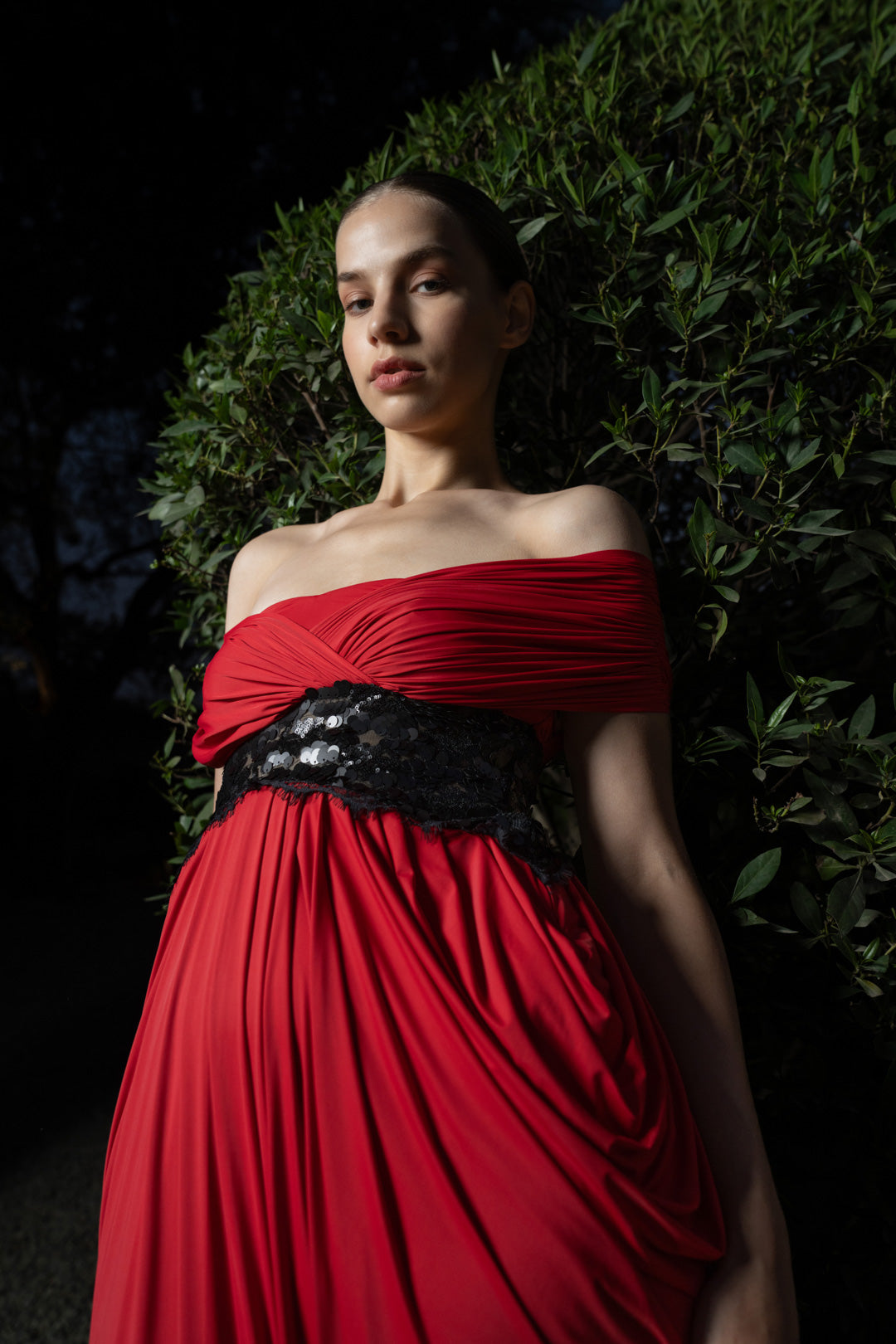 RED DRAPED EVENING GOWN WITH EMBELLISHED WAIST DETAIL