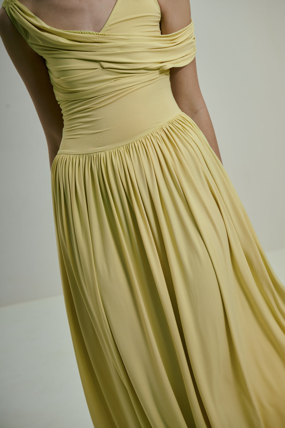 SOFT BUTTER YELLOW DRAPED MIDI DRESS WITH ASYMMETRIC NECKLINE