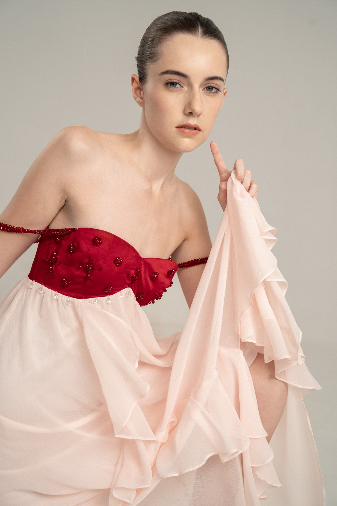 PINK FLOWING MIDI DRESS WITH RED EMBELLISHED BUSTIER